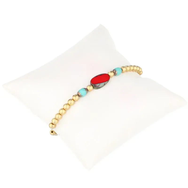Bracelet fantaisie, perles dorées et pierres véritables rouges