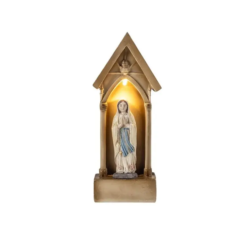 Statue de Notre Dame de Lourdes lumineuse dans une chapelle