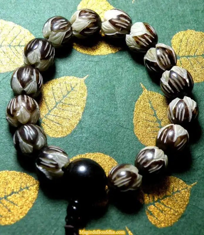 Wrist mala made from carved lotus seeds - Vegetable ivory.