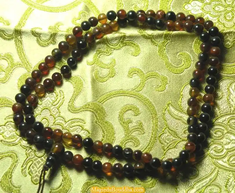 Small Tibetan mala in amber-colored agate.