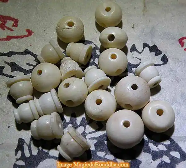Head beads for Tibetan mala in white or black yak bone.