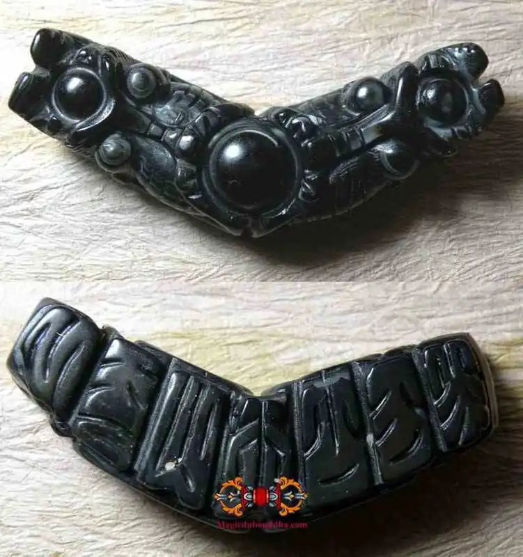 Carved Tibetan magic eye pendant.
