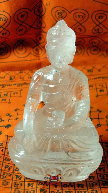 Quartz crystal Buddha statue from Tibet.