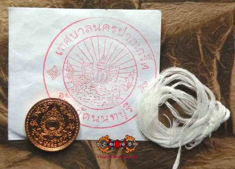 Consecration piece for Buddha statue + sai sin thread