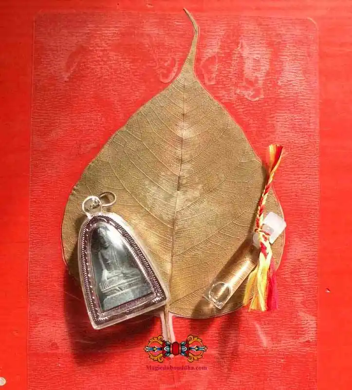 Stone Buddha amulet + relics from the Buddha's birthplace.