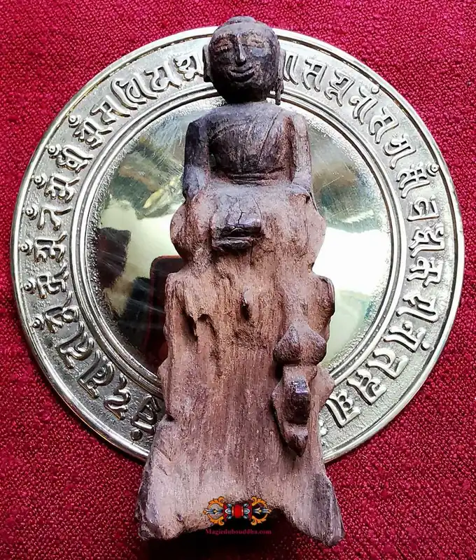 Antique wooden Buddha statue - primitive style.
