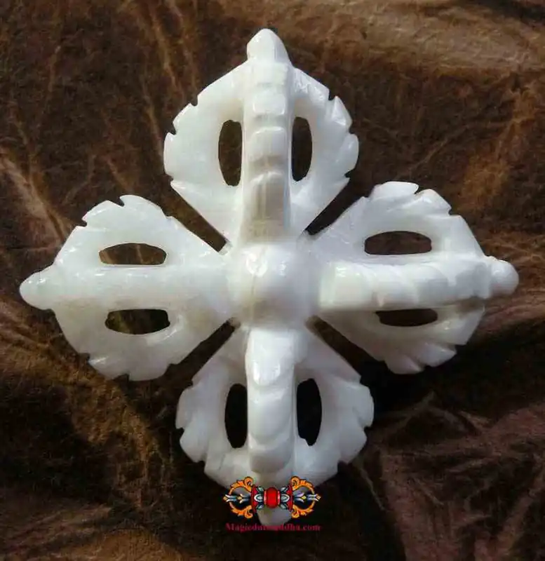 Tibetan double dorje pendant in carved conch.