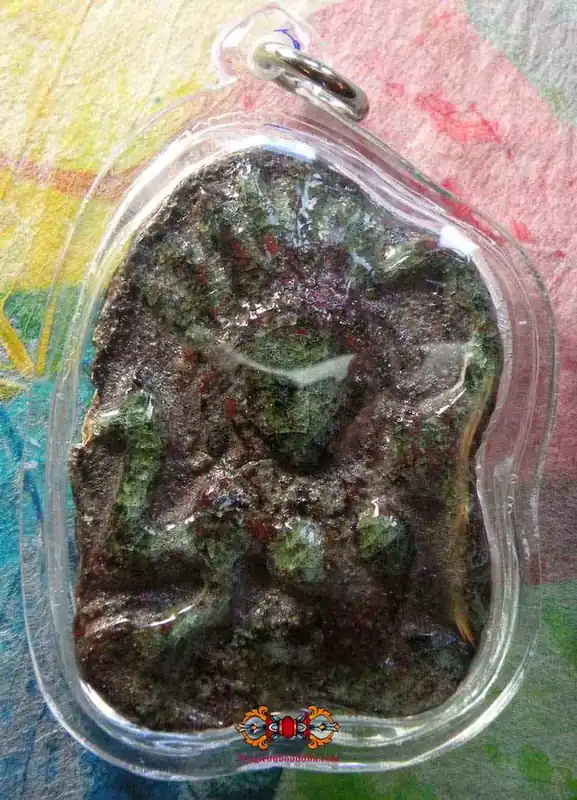 Apsara amulet in alchemical glass.