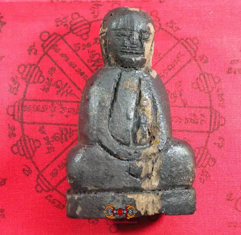 Ancient and primitive wooden Buddha statue