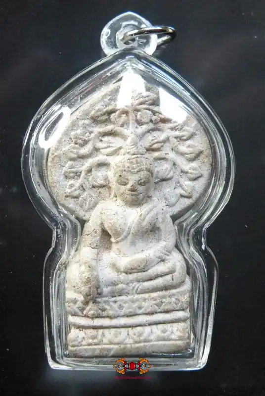 Beautiful ancient amulet of the Buddha under his tree.