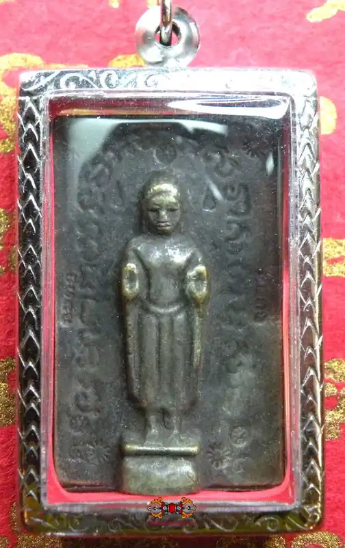 Large Thai amulet of the standing Buddha.