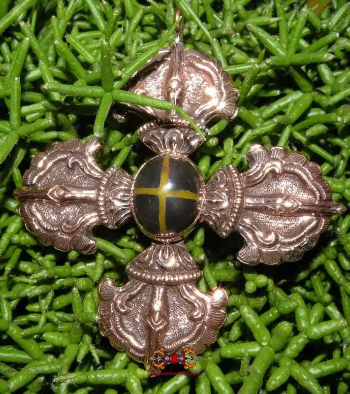 Large double dorje pendant adorned with a stone from Mount Kailash.