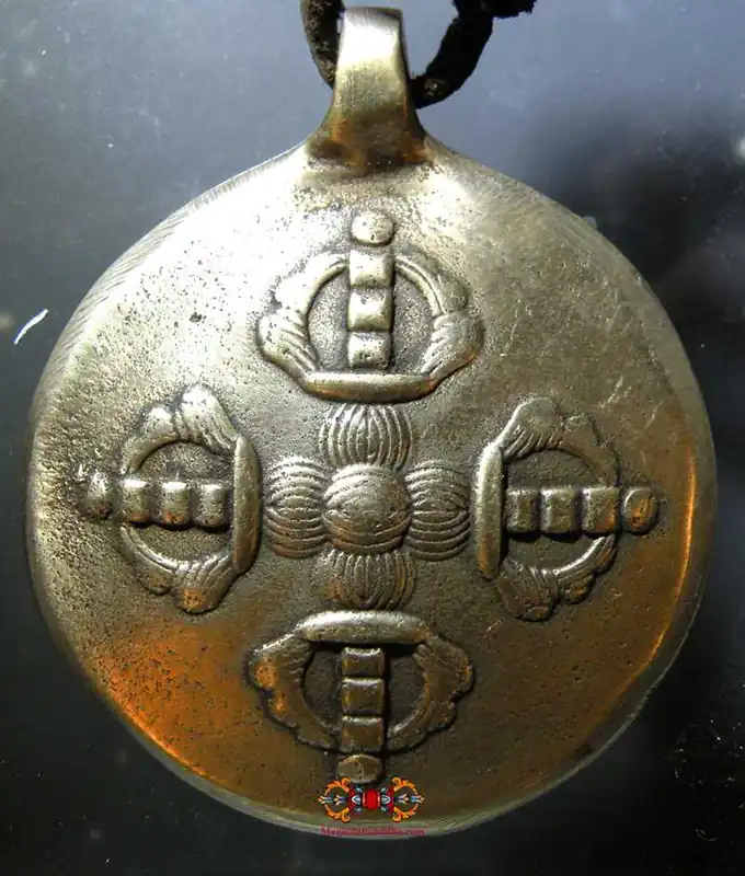 Tibetan Tokchag amulet in the shape of a Melong meditation mirror.