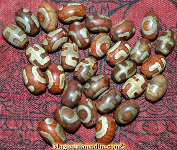 Tibetan Dzi swastika beads - Bonpo tradition.