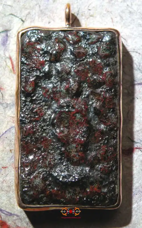 Large Phra Naphok amulet made of alchemical glass.