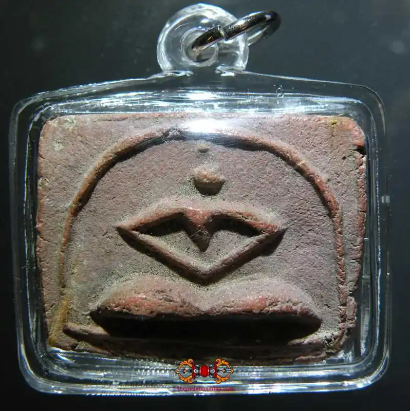 Ancient Thai amulet stylized Buddha.
