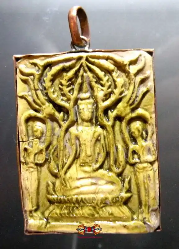 Historical Buddha amulet in green ceramic.