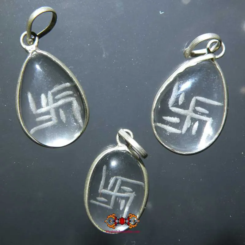 Tibetan rock crystal (quartz) Swastika pendant.