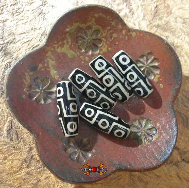 Recent Tibetan Dzi with 9 eyes.