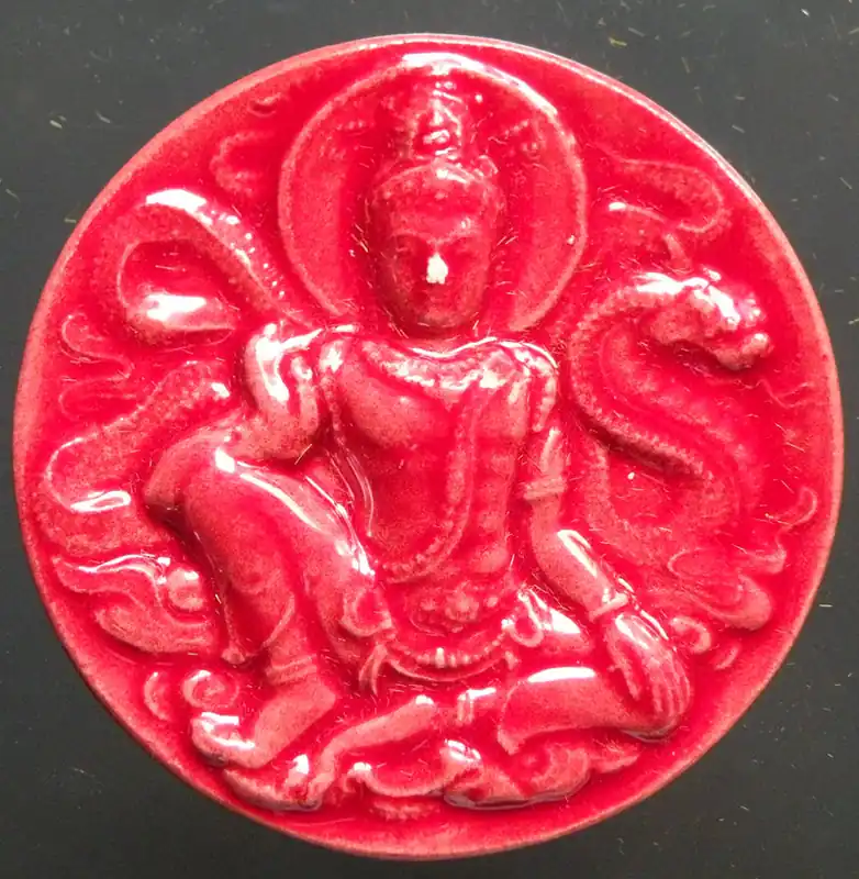 Red ceramic Jatukham Rammathep amulet - Wat Wang Kanai.
