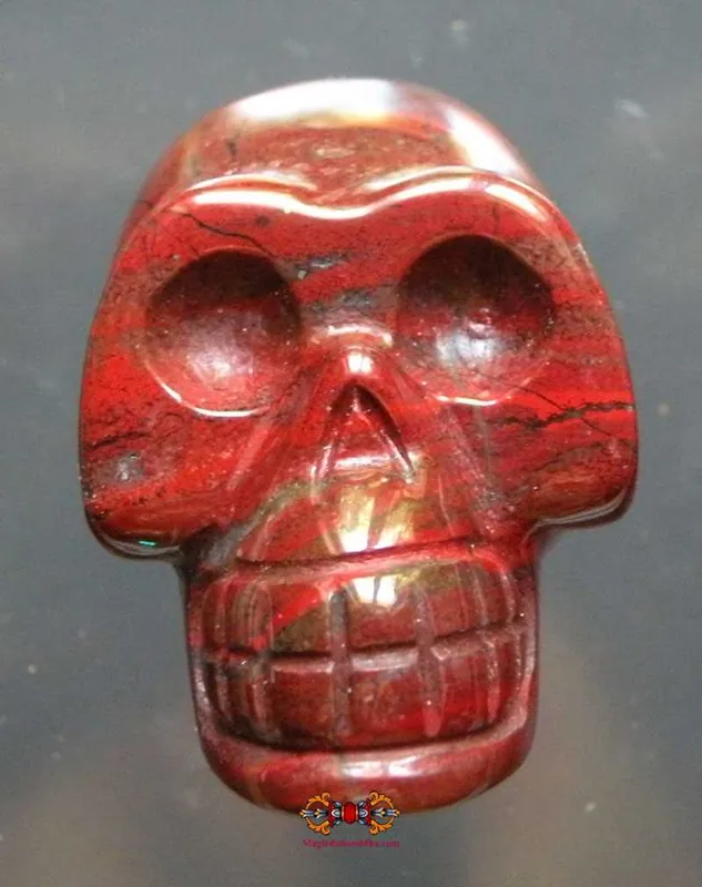 Human skull carved from red stone (Jasper).