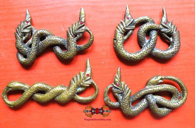 Large Naga talismans and intertwined serpents from Cambodia.