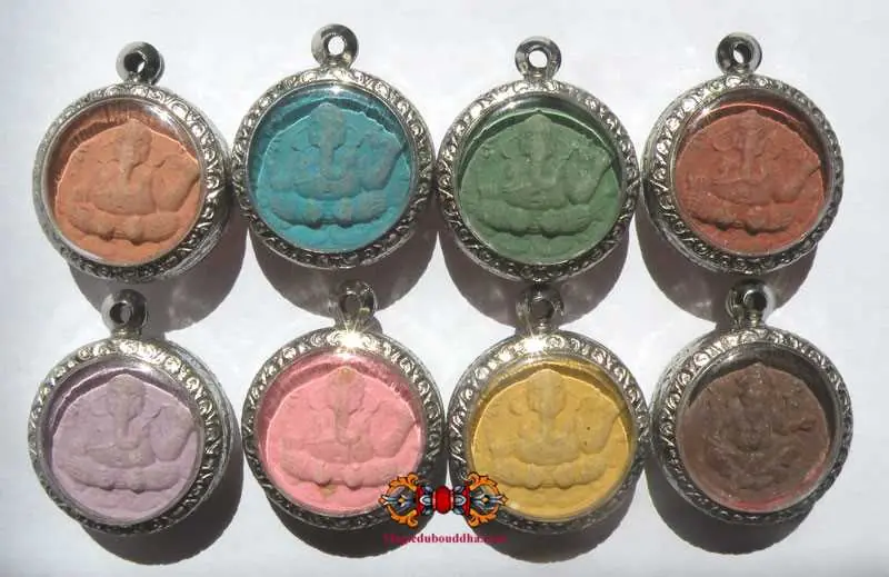 Collection of eight Ganesh amulets in the colors of the days of the week - Wat Kaek.