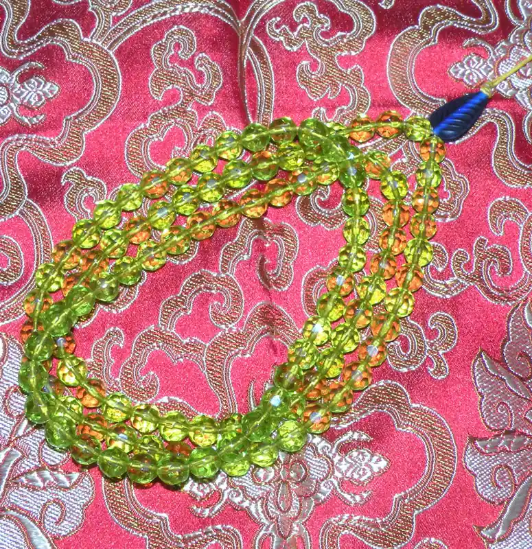 Buddhist mala rosary made of faceted glass beads.