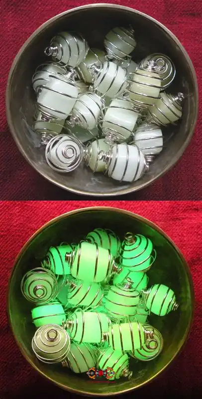 Ye Ming Zhu Fluorescent Stone Pendant (Thai: Hin Ruang Sen) - green or bluish color.