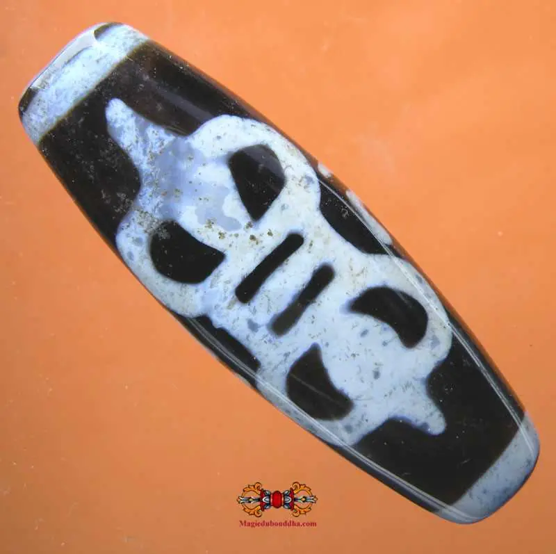 Large black Dzi from Tibet - Dorje and Swastika pattern.