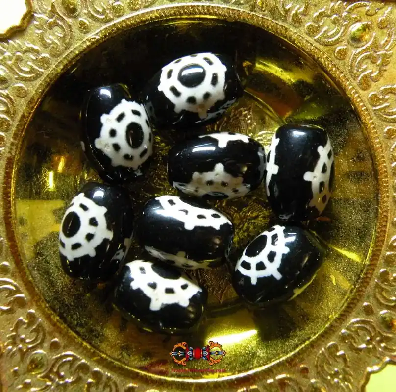 Tibetan Dzi Dharmachakra decoration.