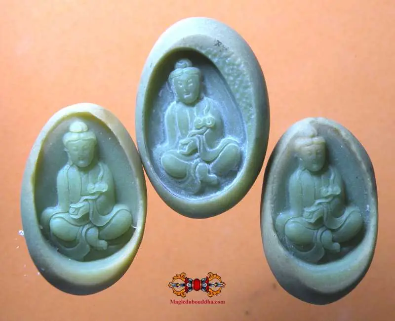 Lotus Buddha carved from a fluorescent Chinese sacred stone pebble Ye Ming Zhu.