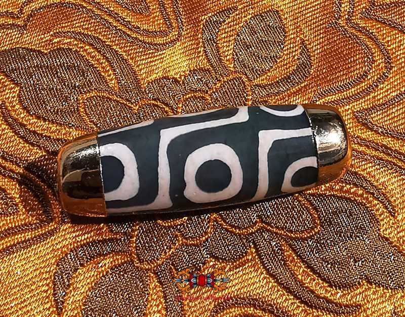 Beautiful green Tibetan Dzi beads with 9 eyes.