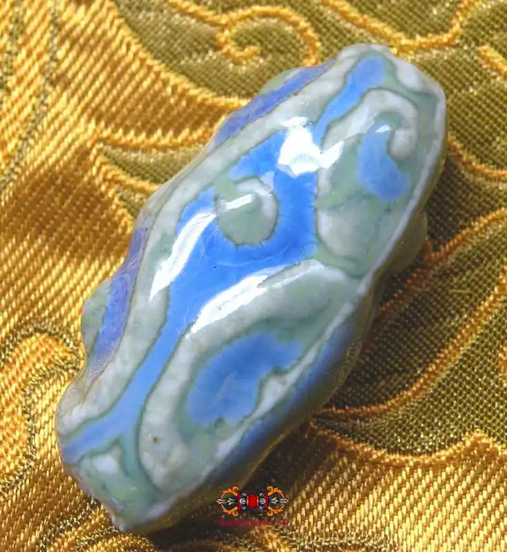 Tibetan green and blue ceramic Dzi style bead.