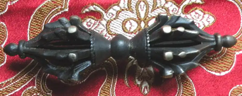 Small Tibetan Dorje in antique bronze.