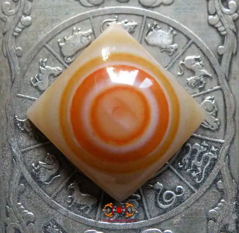 Tibetan magic eye in salmon-colored agate.