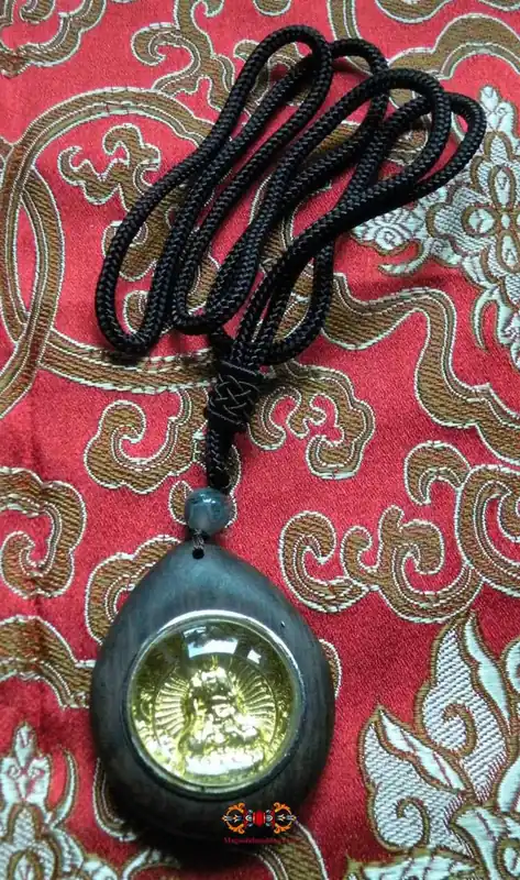 Pendant of Buddha Shakyamuni with integrated prayer wheel.