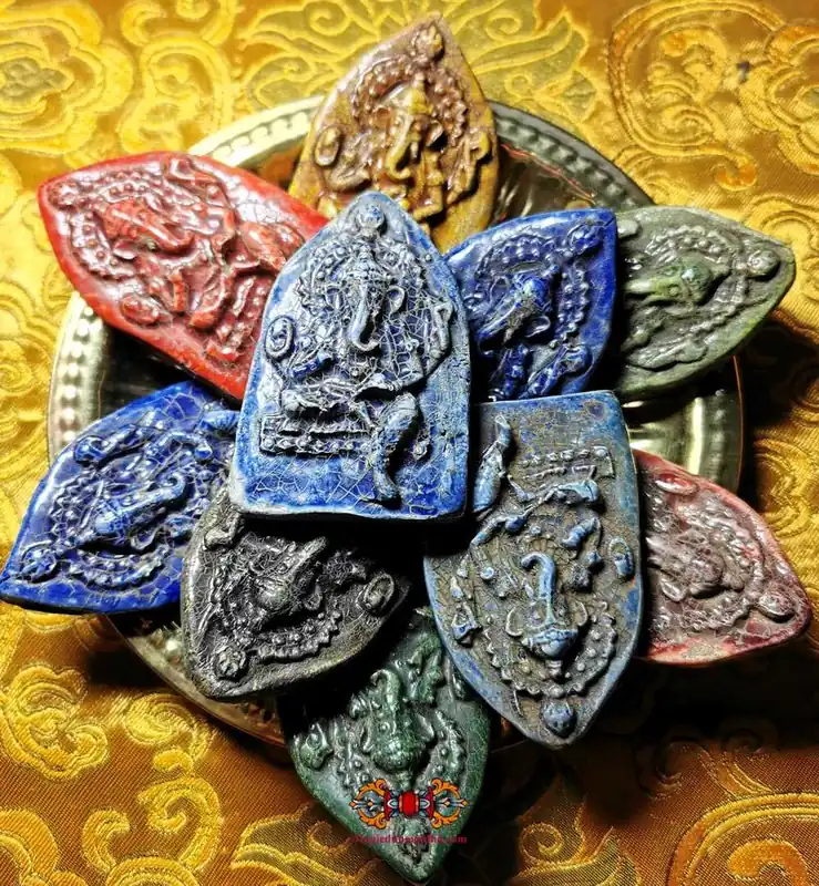 Colorful ceramic votive tablets of Ganesh.