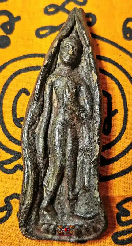 Ancient votive tablet of the standing Buddha.