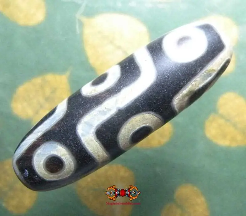 Large Tibetan Dzi with nine eyes.