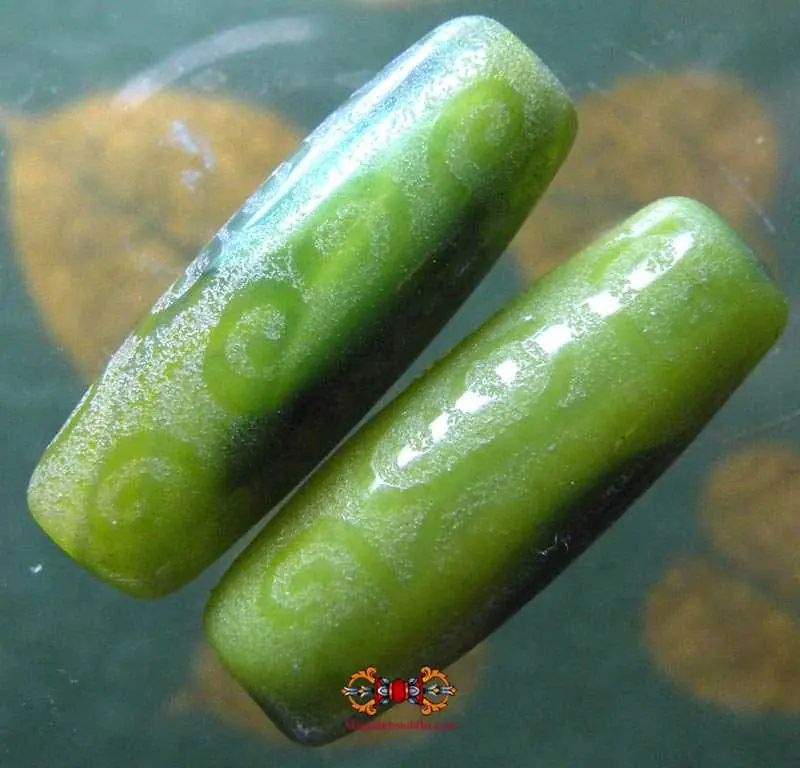 Pair of green Tibetan Dzi.