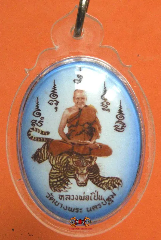 Amulet portrait of the Most Venerable LP Pern on a tiger.