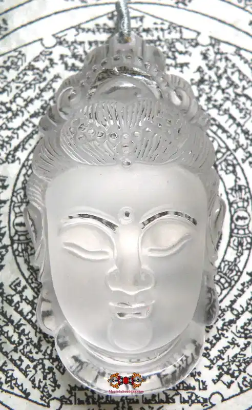 Superb carved rock crystal Guan Yin face pendant.
