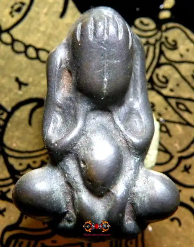 Small Thai alchemical amulets of the protective Buddha Phra Pidta.