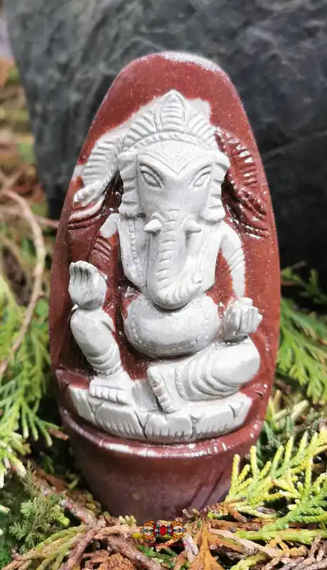 Ganesh carved in a Shiva Lingam.