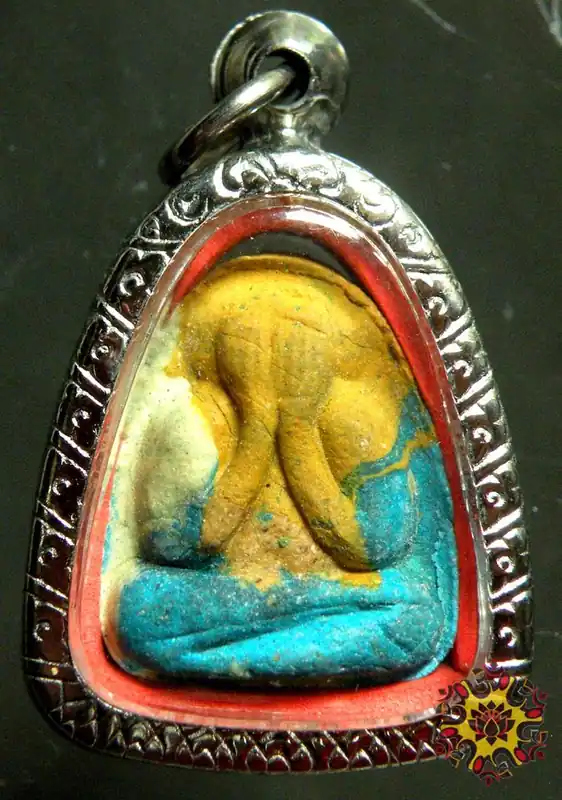 Multi-colored Thai amulet of the protective Buddha Phra Pidta.