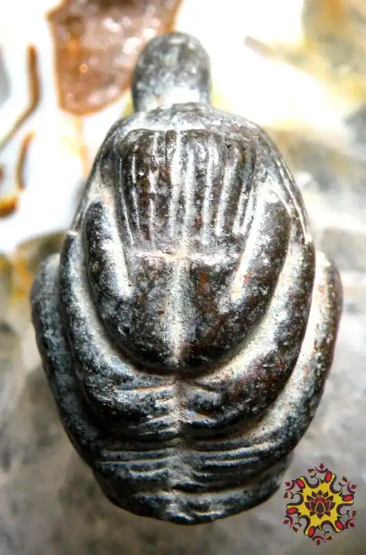 Ancient Thai protective amulet of the six-armed Buddha Phra Pidta.