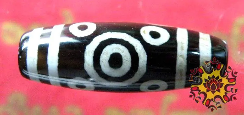 Sacred Tibetan Dzi bead with eleven eyes.
