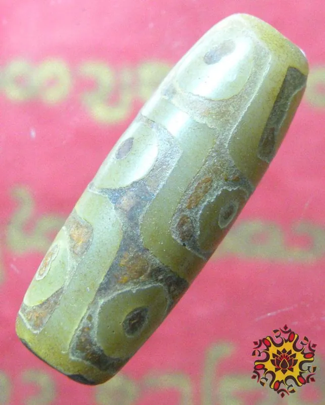 Sacred Tibetan Dzi bead with nine eyes.