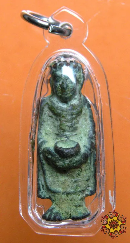 Ancient Thai amulet of the standing Buddha.